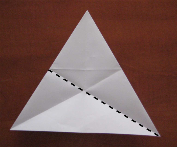 Bring the right bottom point up to the top point to fold in half
Unfold
